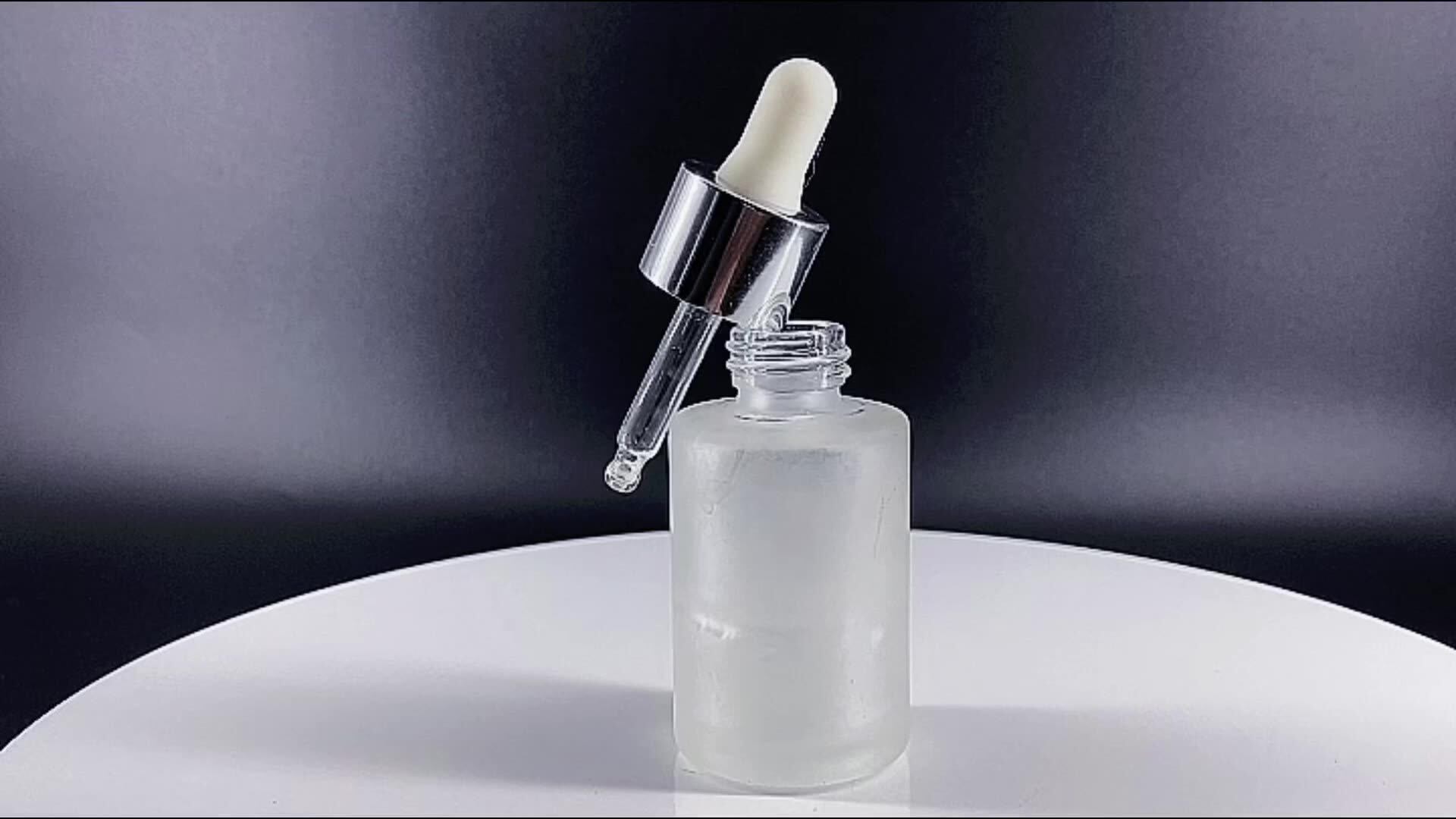 Clear serum glass dropper bottle showing clean hydrating droplet texture