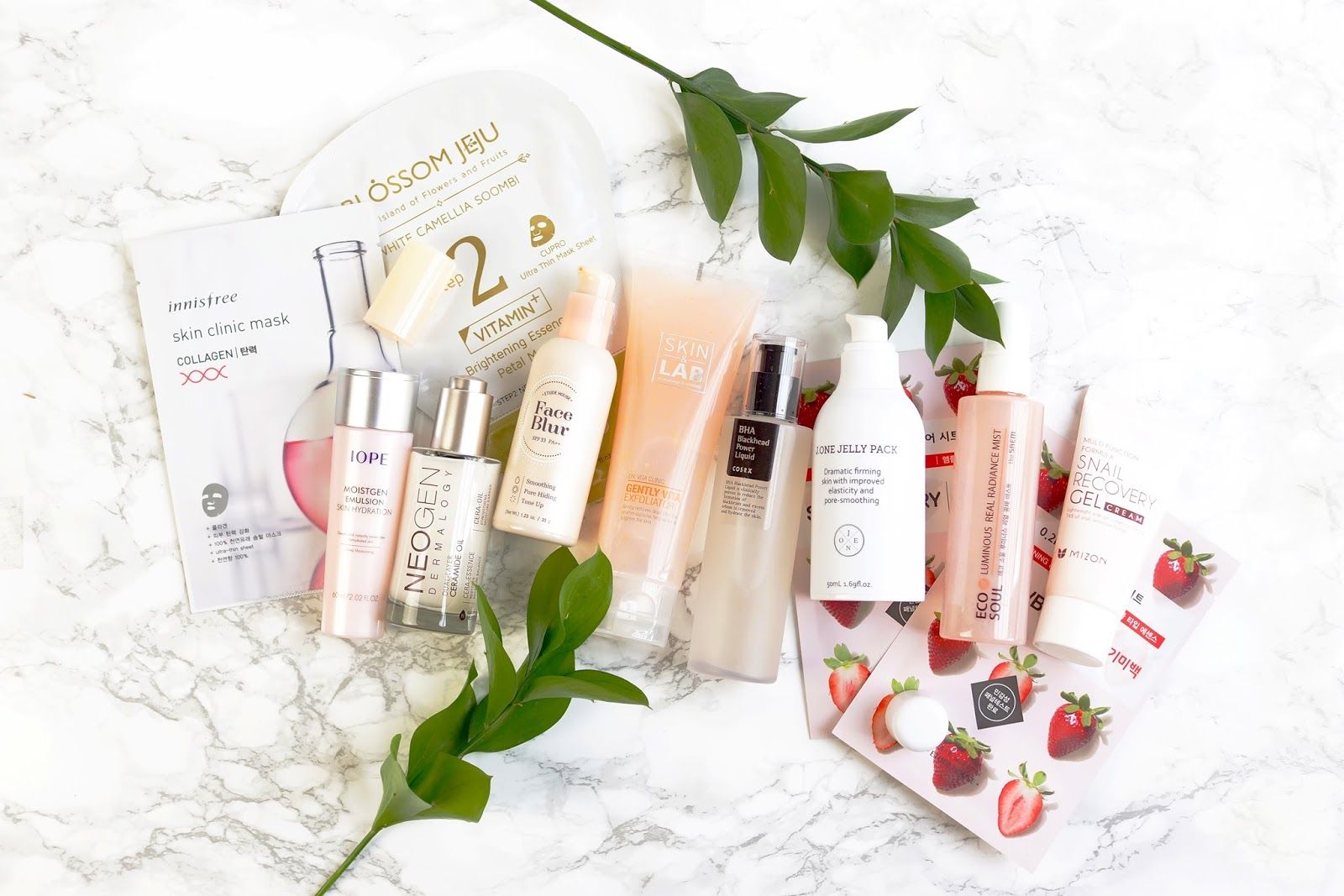Korean beauty skincare serums and cosmetic product setup on a counter