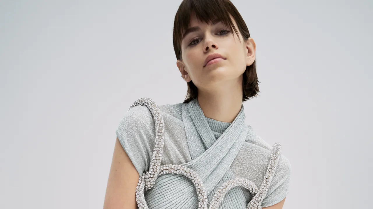 Minimalist aesthetic fashion model posing in neutral-toned clothing